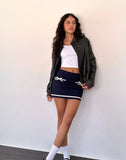 Image of Babeda Bow Mini Skirt in Navy