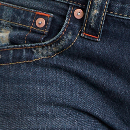Low Rise Twisted Seam Jeans In Mid Blue Tint