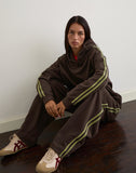 Image of Oze Trackpant in Bitter Chocolate with Green Binding and M Embroidery