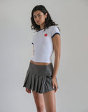 image of Salida Top in White with Navy Binding and Apple Motif