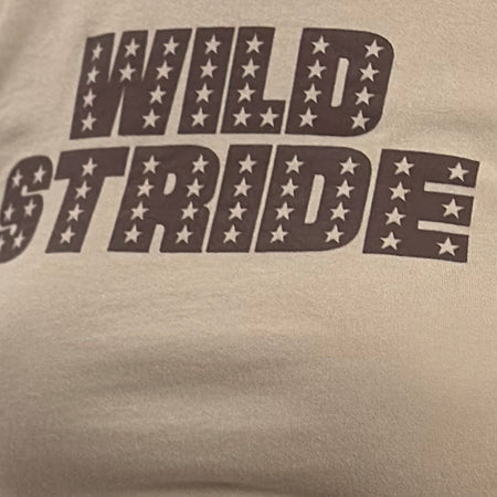Sutin Tee in Coconut Milk with Wild Stride Graphic