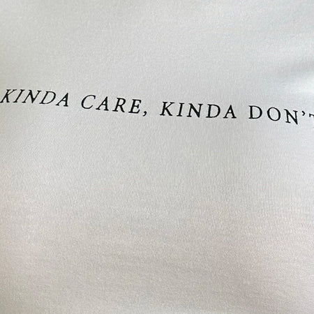 Sutin Top in White with Kinda Care Kinda Don't Graphic