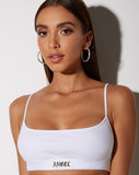 Esme Bralet in White with 'Angel' Embro