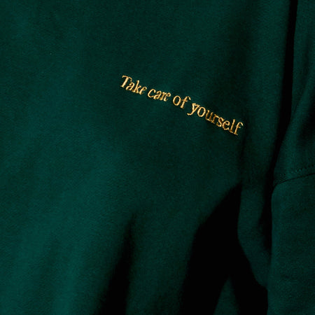 Glo Sweatshirt in Bottle Green with 'Take Care Of Yourself' Embro