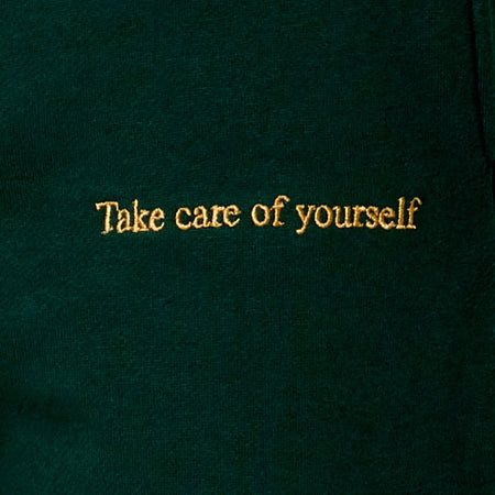 Basta Jogger in Bottle Green with 'Take Care Of Yourself' Embro