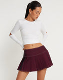 image of Zabini Low Rise Pleated Mini Skirt in Burgundy with Ecru Stitch Detail